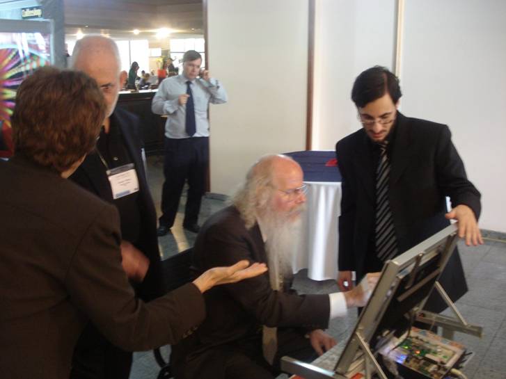 Fig. 2. Larry Weber, President of SID, is testing the student desk in the booth of City of Serrana at LatinDisplay 2007 Exhibition.